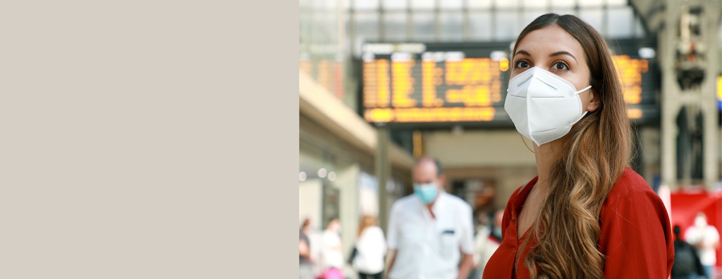 girl at airport in mask